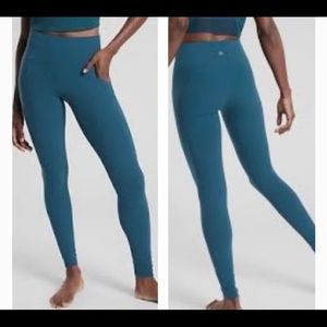 ATHLETA Salutation 7/8 Tights with Stash Pocket. Teal blue medium.